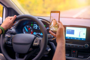 Man Taking Selfie While Driving